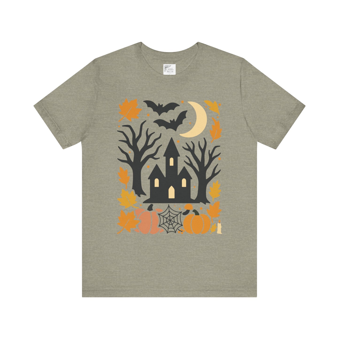 Unisex t-shirt with a haunted house, pumpkins, bats, and full moon Halloween graphic.