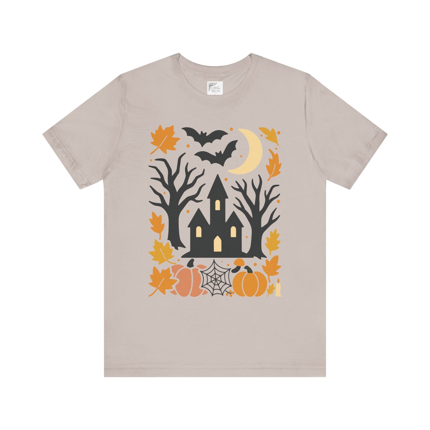 Unisex t-shirt with a haunted house, pumpkins, bats, and full moon Halloween graphic. halloween tee