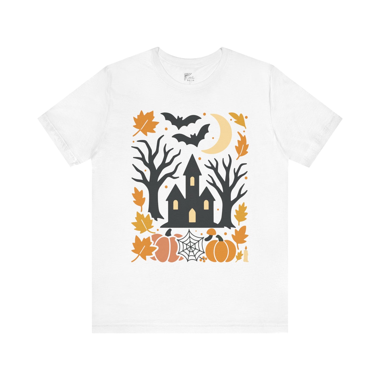 White t-shirt with Halloween-themed design featuring a castle, trees, pumpkins, and bats on a white background.